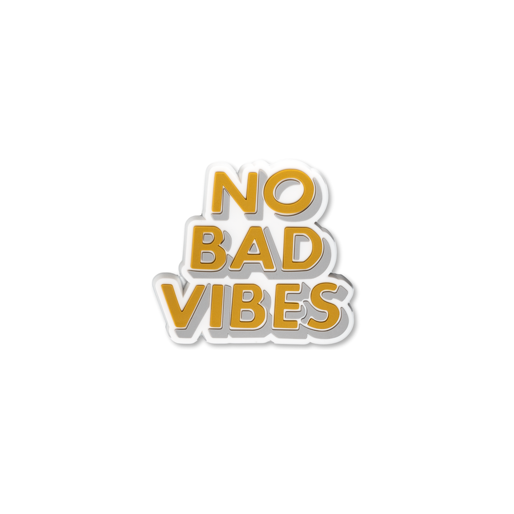 Gold No Bad Vibes decorative charm with bold 3D lettering