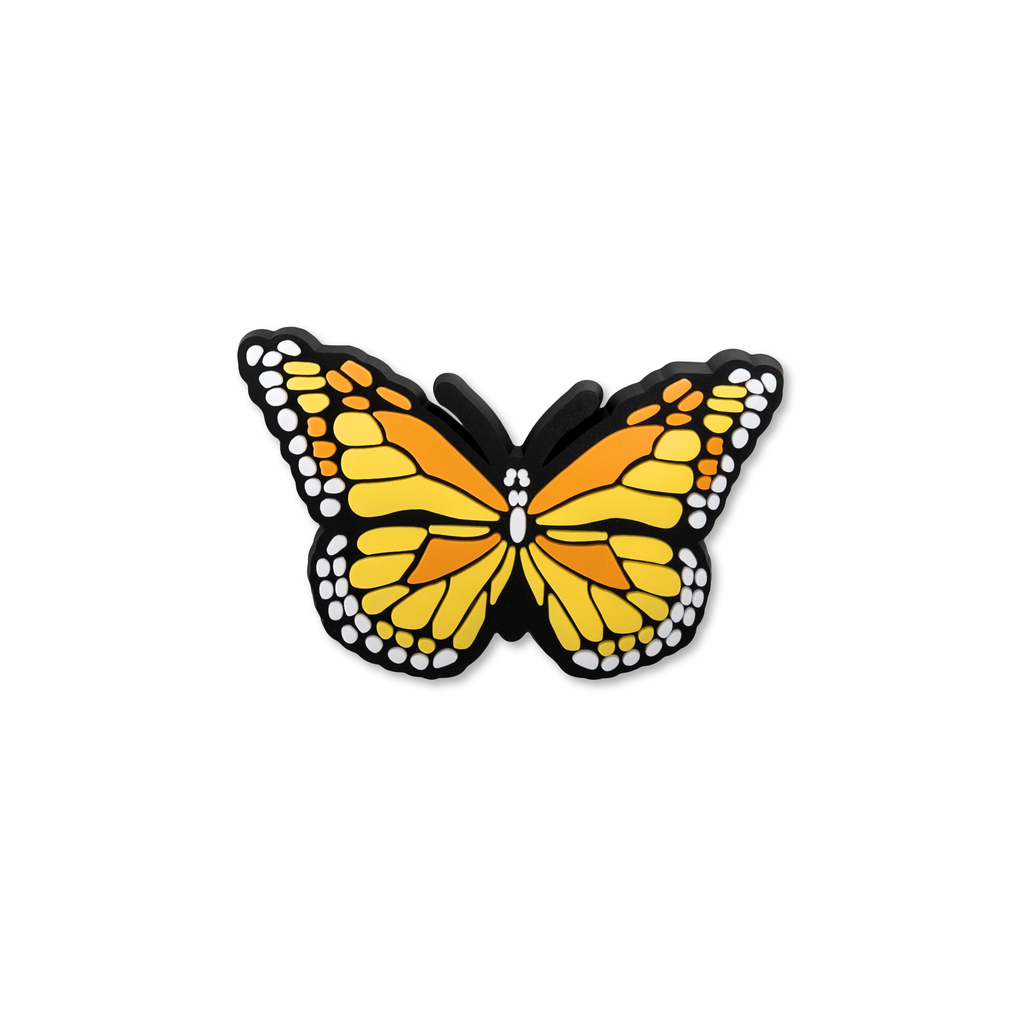 Orange and yellow monarch butterfly decorative charm with black and white spotted wing edges